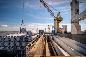 Wind turbine blades being loaded onto a boat at Avondale, Louisiana