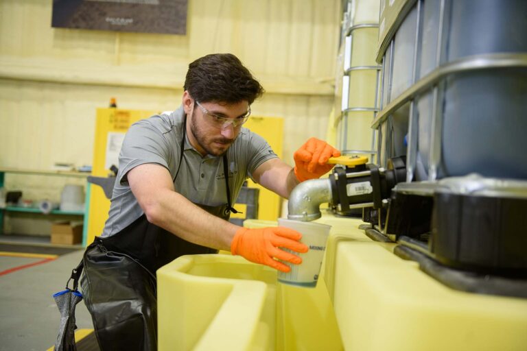 Engineer mixes resin for a composite repair