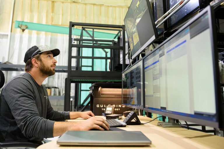 Engineer sat monitoring a wind tunnel