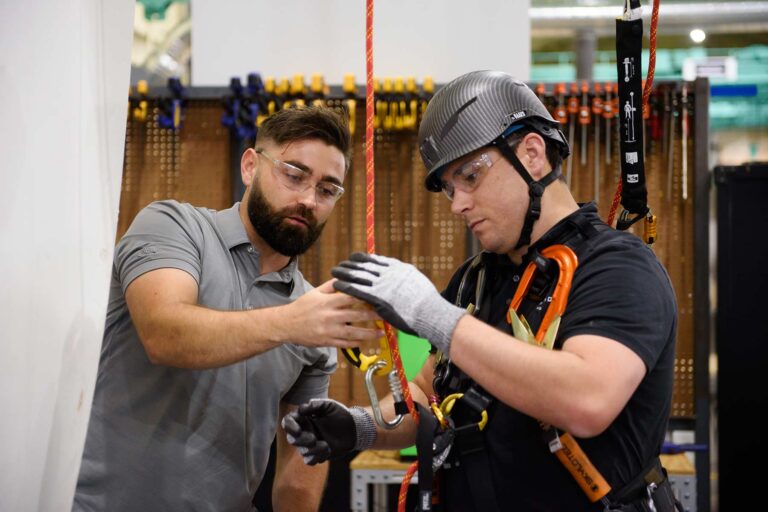 Technician being trained on a wind turbine blade