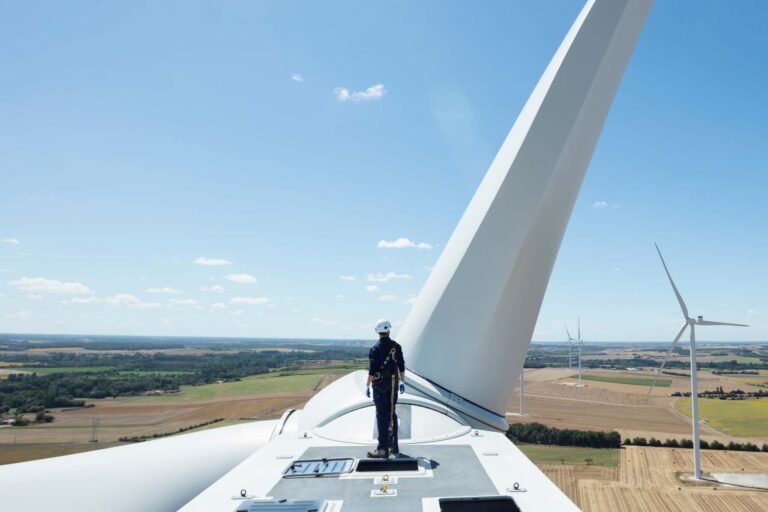 Blade Technician stood on top of a wind turbine