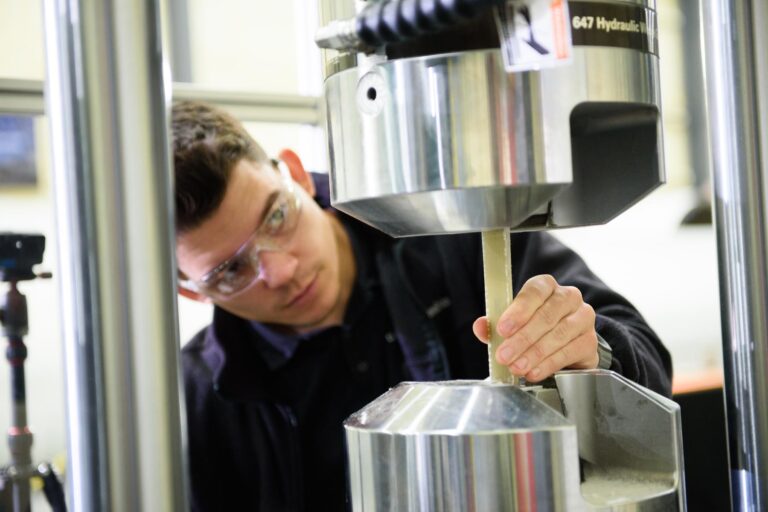 Engineer Testing a sample on a MTS machine